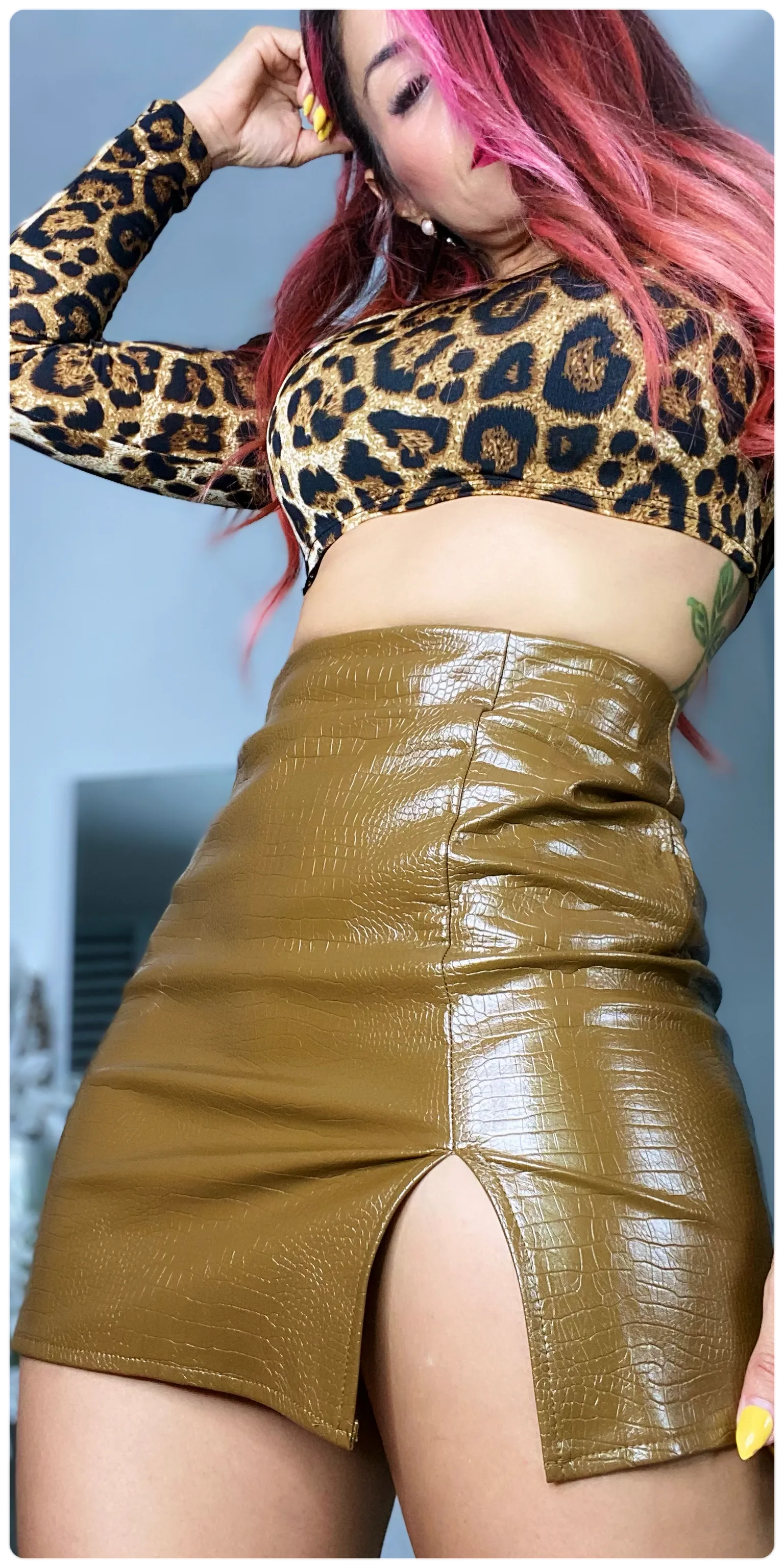 Snake in leather mini skirt